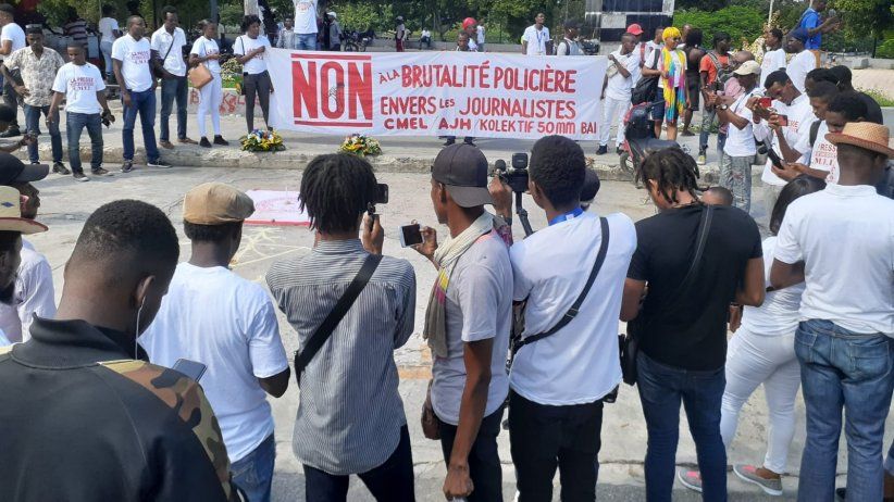 Journalists dressed in white march to denounce murders in Haiti